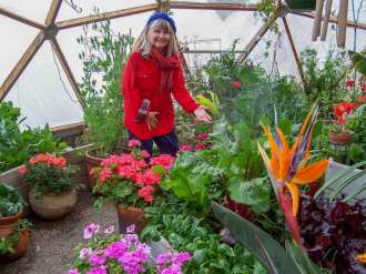 Puja Parsons in Growing Dome Greenhouse