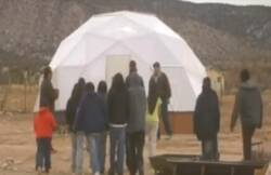 People in front of a greenhouse at Navajo Nation