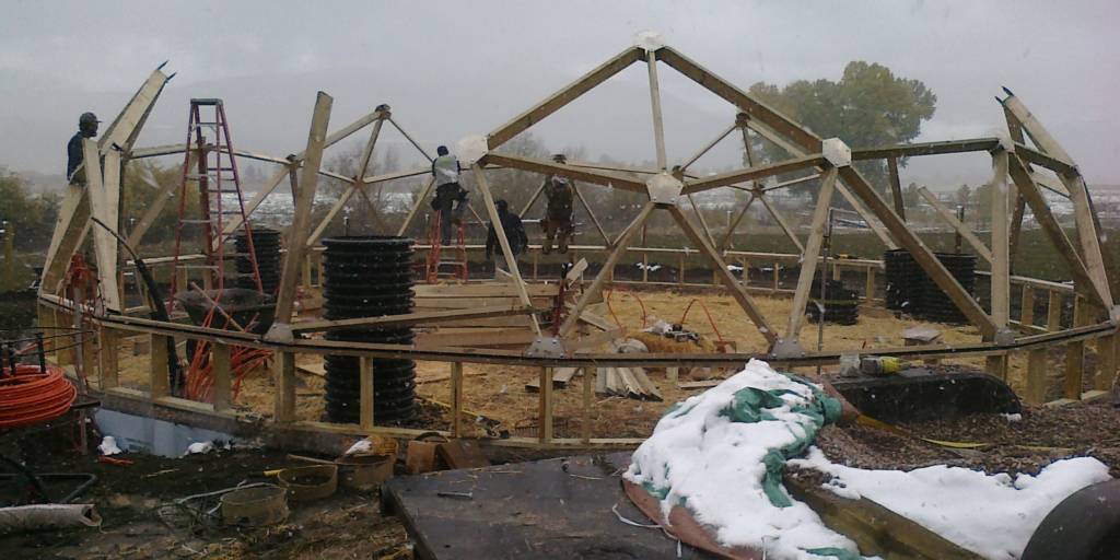 Geodesic Dome Greenhouse being built in teh winter