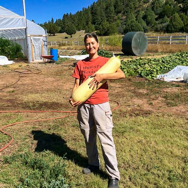 Growing Spaces gardener Heather Gray with a 24 pound zucchini