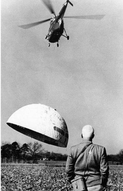 Buckinster Fuller geodesic dome being lifted by helicopter