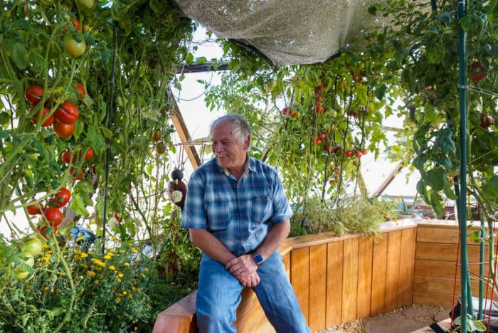 Richard Swank in his custom greenhouse