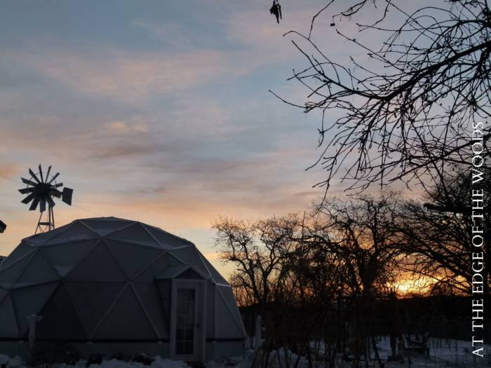 sunset behind a geodesic greenhouse