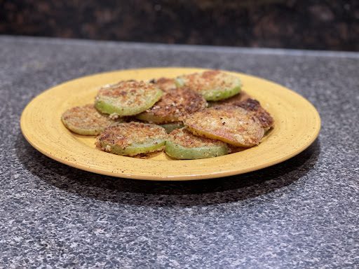 finished fried green tomatoes on yellow plate
