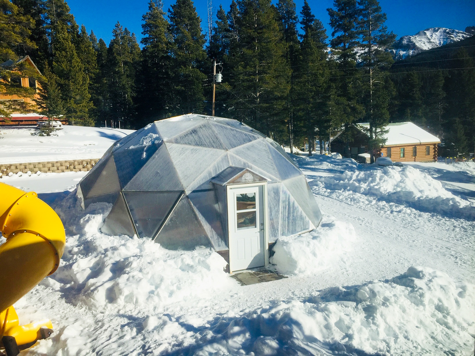 closed loop food system geodesic greenhouse in the snow in montana