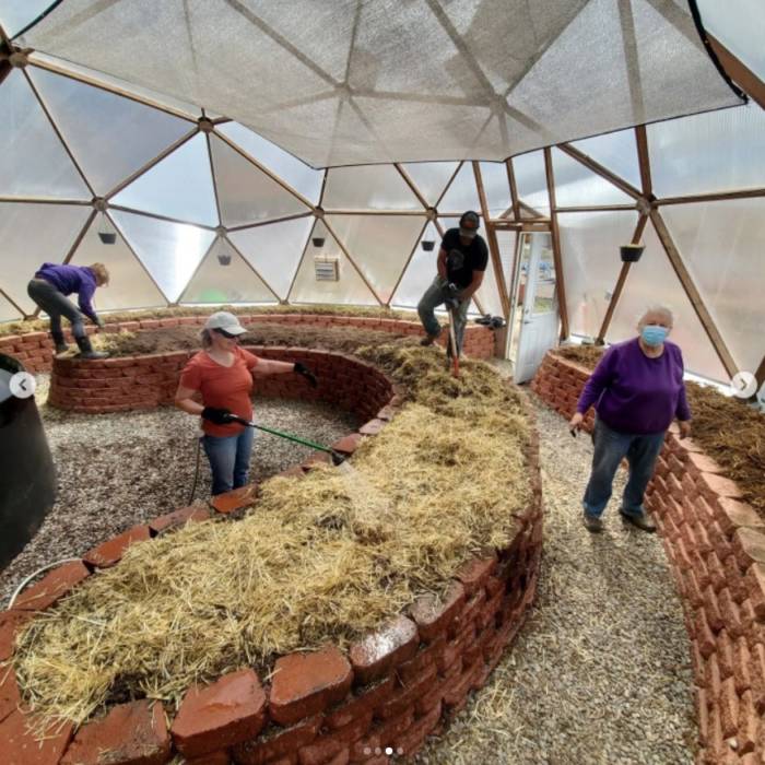 Pine River Shares volunteers working in Growing Dome greenhouse