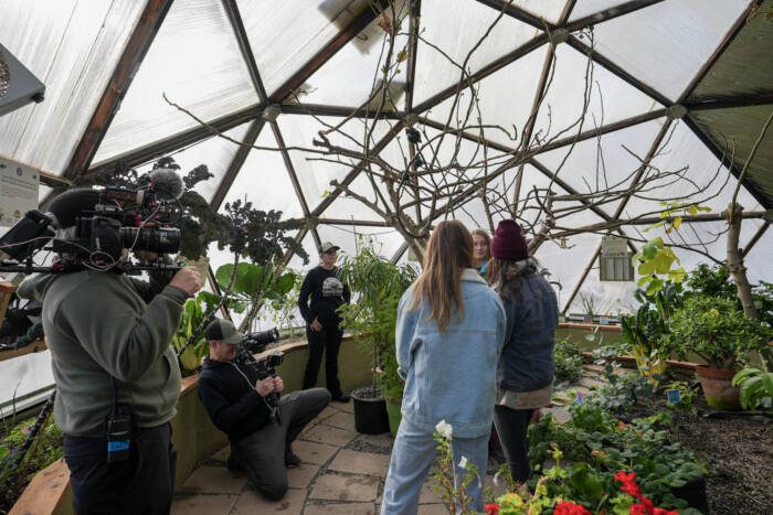 HGTV filming an episode of Building Roots in a Growing Dome Greenhouse