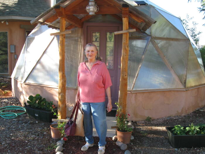 Anne Jackson posing in front of her growing dome