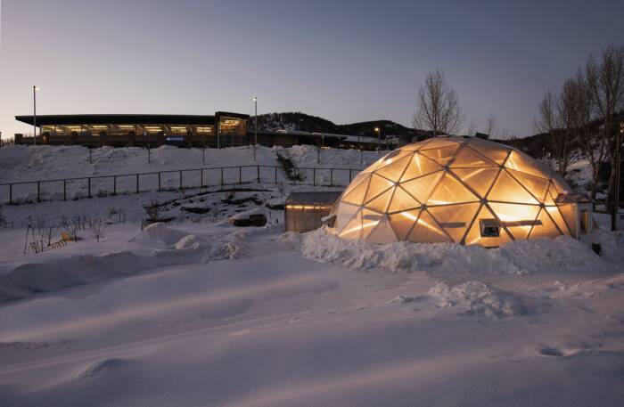 geodesic greenhouse in the snow