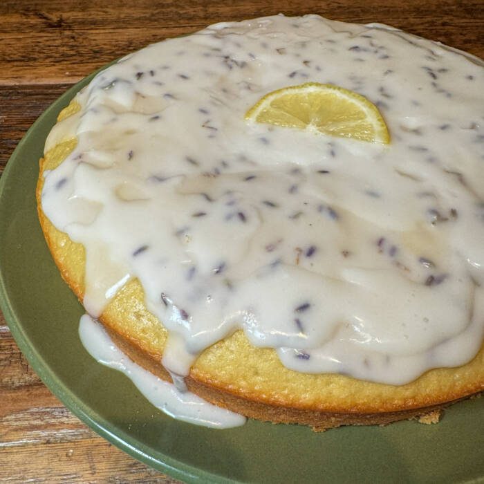 up close image of lavender glaze on lemon olive oil cake